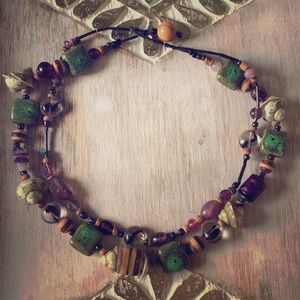 Green and purple ceramic and seashell bracelet